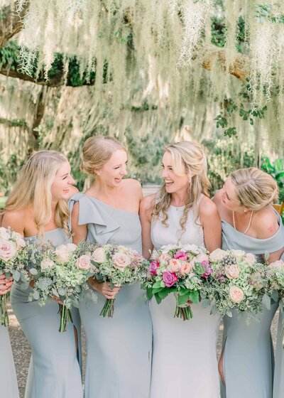 Bride and Bridesmaids laughing at jekyll Island Clu