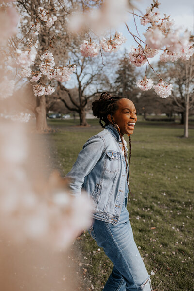 Your destination elopement photographer. Jessica in spring with cherry blossoms around