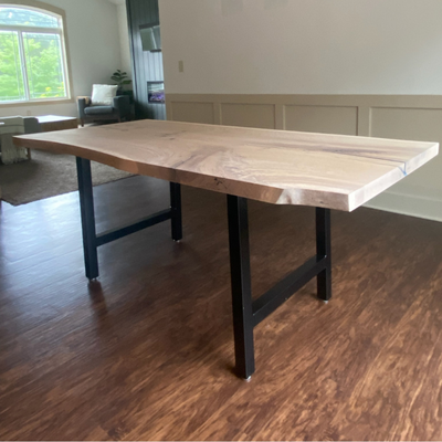 The finished Farmhouse-Style Dining Table complete with table settings