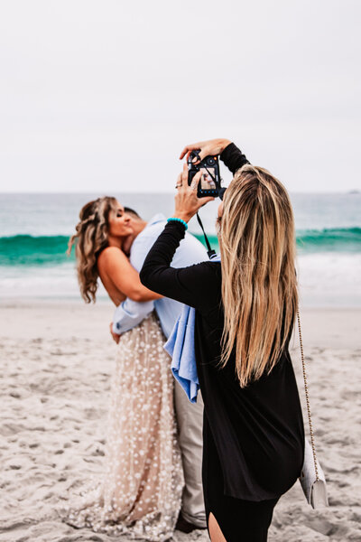 Candid photo of a couple embracing during their Lake Tahoe elopement on the beach