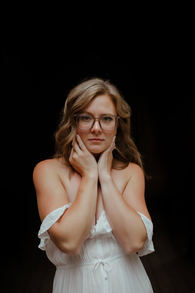 woman posing with hands on chest