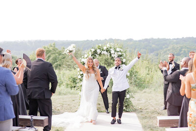 Bride and Groom Cheering after their wedding ceremony