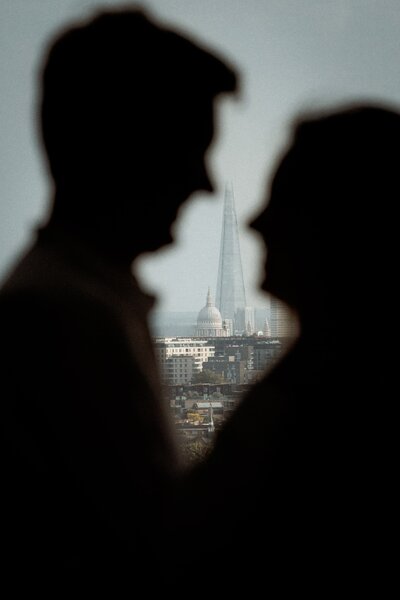 Outdoor urban elopement photography with view of London iconic landmarks and St Paul's in the background