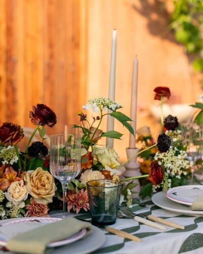 Colorful low centerpiece with garden roses by Kendra’s Events in Dallas.