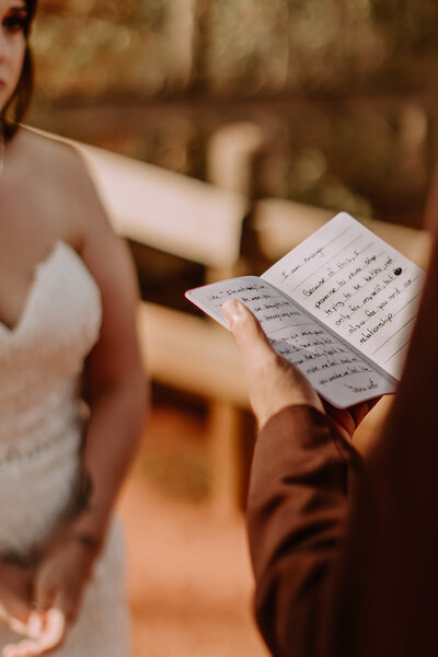 Picture of Bride in front of florals - Photo taken by Orlando Wedding Photographer - Fearless & Brave Photography