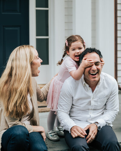 family embracing in field