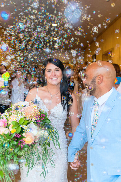 Flat lay of bridal accessories including shoes, veil, jewelry, and ring box, styled and photographed by Joseph Mayden to capture elegant wedding day details.