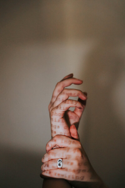 KP holds her hands while a typewriter effect is displayed on them.