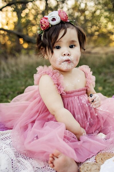 family of three at a cake smash session