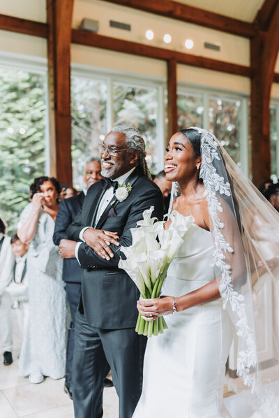 Father walking daughter down the aisle