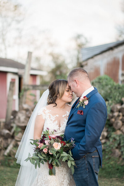 a newly married couple smile at the camera a their Colorado Wedding Photographer
