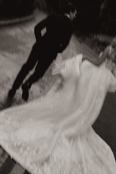 California couple walking the streets in the evening after their wedding day