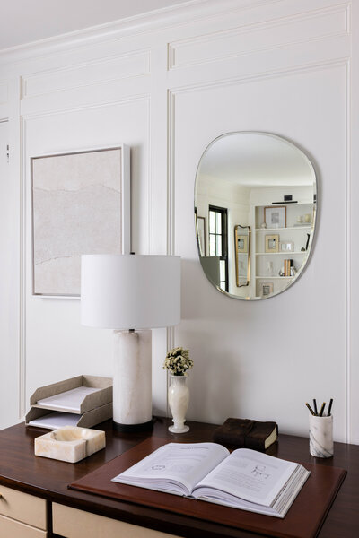 A sophisticated home office design featuring a rich wood desk, marble accents, and layered textures for an elegant workspace. Designed by Deni + Dove Interiors, serving Chatham, Essex Fells, Glen Ridge, Hohokus, Madison, Maplewood, Millburn, Mountain Lakes, Montclair, Ridgewood, Short Hills, South Orange, Summit, and surrounding NJ towns.