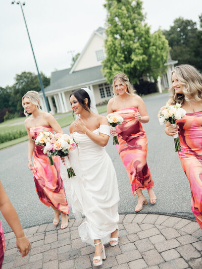 Bride walking with bridesmaids, taken by one of the top baltimore photographers