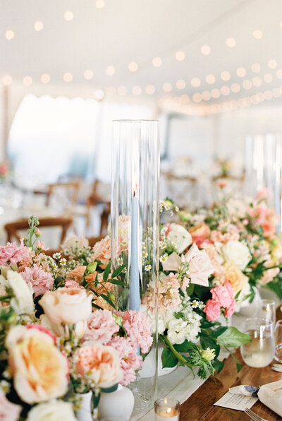 flowers and candles at tented mount hope farm wedding in bristol, RI