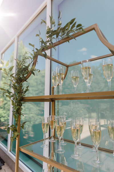 glass shelves with champagne flutes