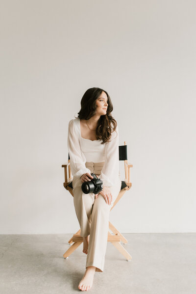wedding photographer in studio chair portrait