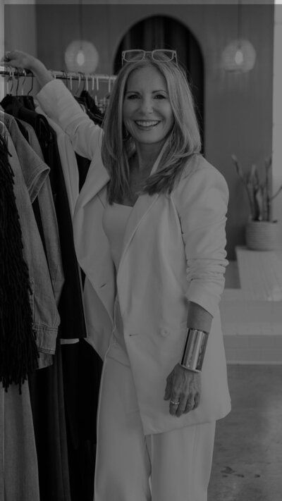 portrait of creative professional in casual setting with natural lighting black and white