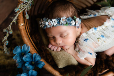 baby girl in tiny papasan chair wearing boho outfit