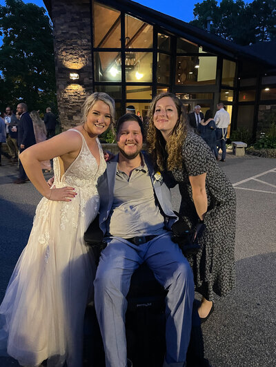 photographer with bride and groom