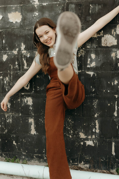 Senior showing her personality in a downtown scene