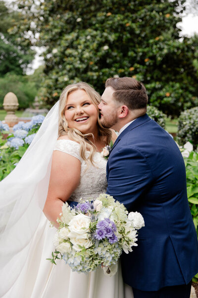 groom kissing bride atlanta wedding