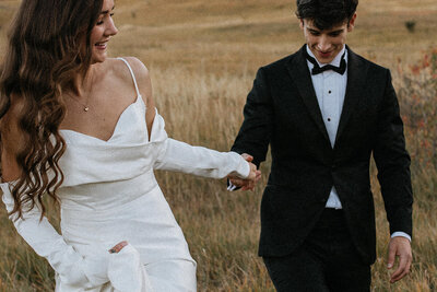 Bride and groom laughing close together  taken by fargo wedding photographer kiella lawrence