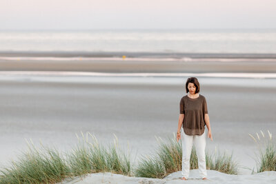 A sophrologist meditating on the beach.