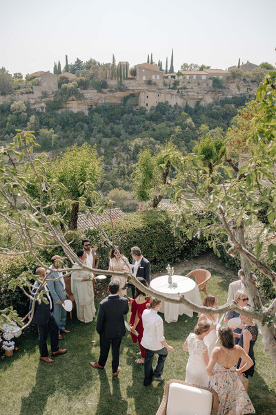 Bastide de Gordes cocktail hour in an enclosed garden with beautiful valley views