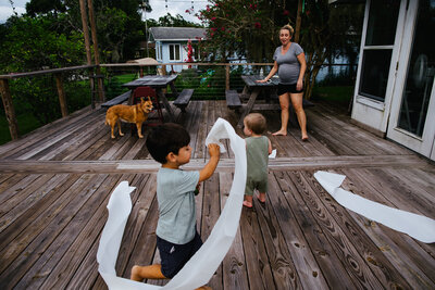 Pregnant mom with two foster babies running around in chaos