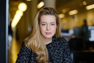 Confident professional woman with blonde hair in business attire, executive headshot and branding portrait in New York City.