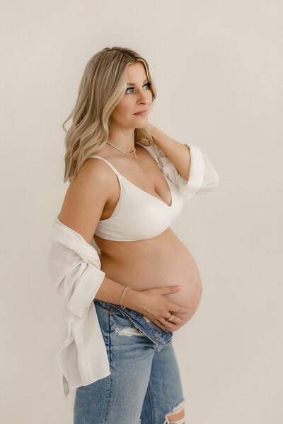 Sleeping newborn wrapped in soft, earthy hues during a Denver photography session