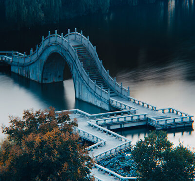 Decorative image of s Chinese stone bridge symbolizing a  strong style of writing.