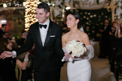 bride and groom big smiles down the aisle bryant park grill