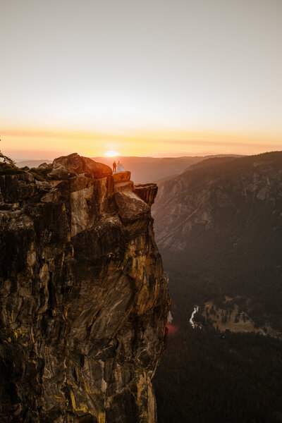 bride and groom at taft point in yosemite during their elopement