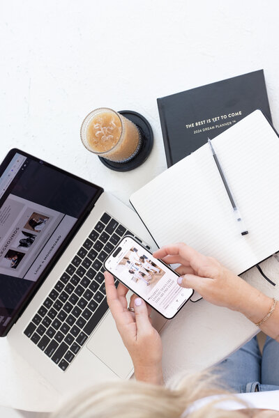 
An image of Tara’s laptop and phone, symbolizing the connections being made in Queen Creek through Connect Belong, where women entrepreneurs build relationships and grow together.