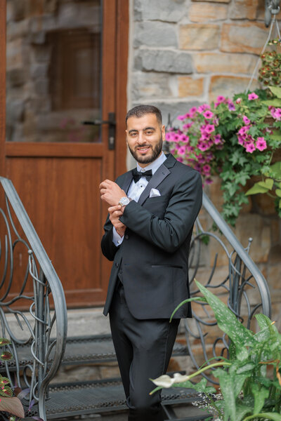 Groom adjusting watch