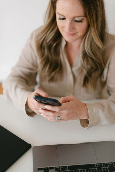 A woman texting on her cellphone