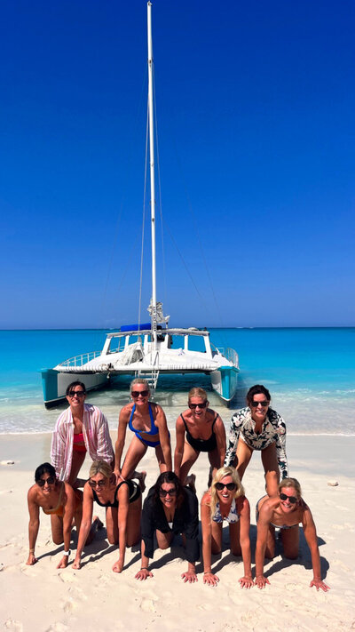 A group of ladies in a pyramid form

