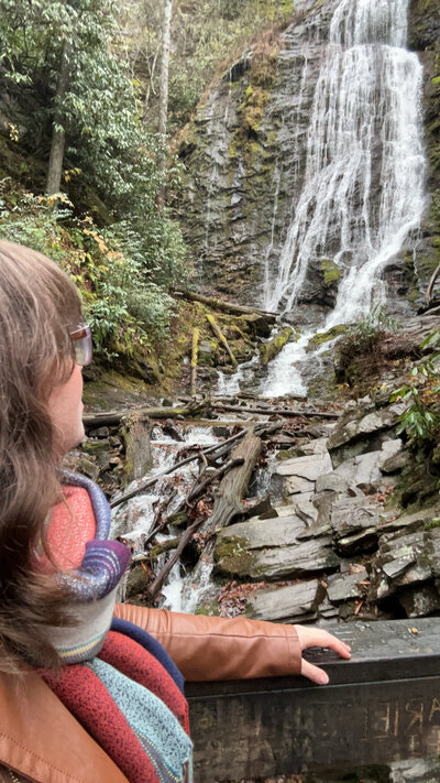 Caroline Amelie looking at a waterfall 