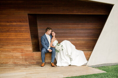 minneapolis walker art center wedding couple sits in beautiful modern bench