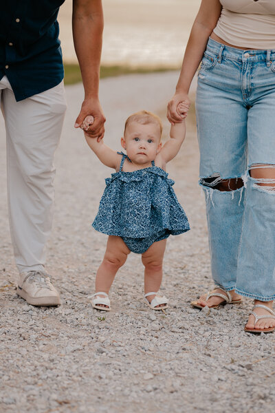 Outdoor family photoshoot in Omaha park during golden hour – capturing candid, heartfelt moments.