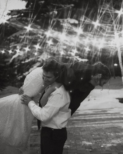 groom carrying bridge