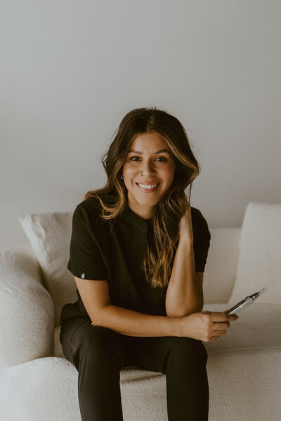 Esthetics by Jillian owner sitting for branding shoot