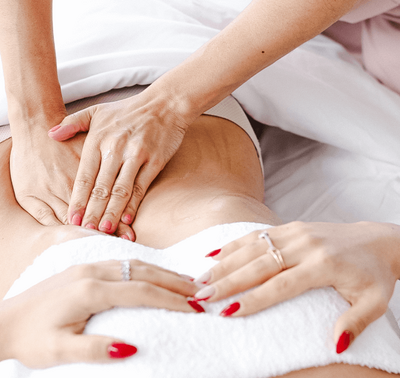 Hands giving a lymphatic massage for circulation and drainage