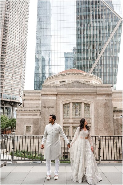 An indian couple taking photos before their sangeet ceremony in seattle