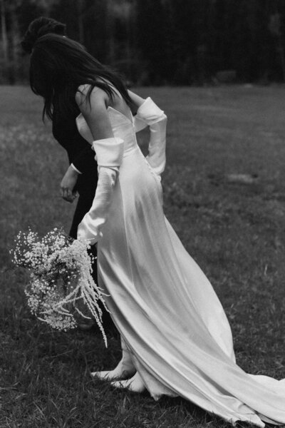 Bride and Groom dancing in the fields in Canada