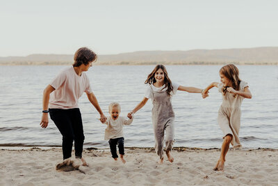 Siblings playing at the beach