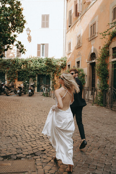 bride and groom eloping in rome captured by elsie goodman, a destination and italy wedding photographer