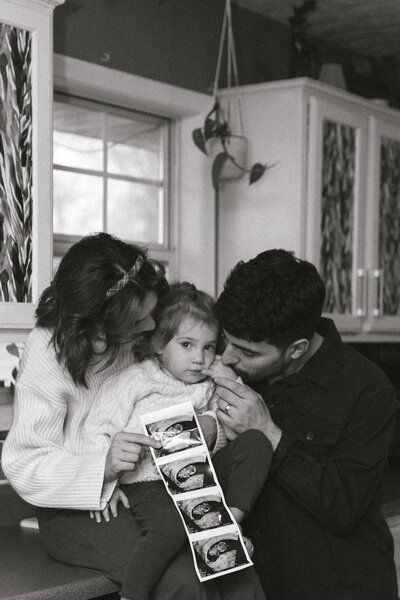 In home Missouri family session announcing pregnancy